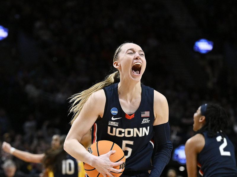 Apr 1, 2024; Portland, OR, USA; UConn Huskies guard Paige Bueckers (5) celebrates after beating the USC Trojans in the finals of the Portland Regional of the NCAA Tournament at the Moda Center. Mandatory Credit: Troy Wayrynen-USA TODAY Sports