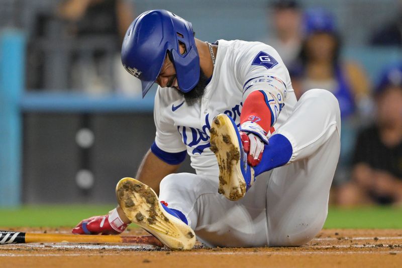 Sep 6, 2024; Los Angeles, California, USA; Los Angeles Dodgers left fielder Teoscar Hernandez (37) reacts as he grabs his left foot as he reacts after being hit by a pitch in the first inning against the Cleveland Guardians at Dodger Stadium. Mandatory Credit: Jayne Kamin-Oncea-Imagn Images