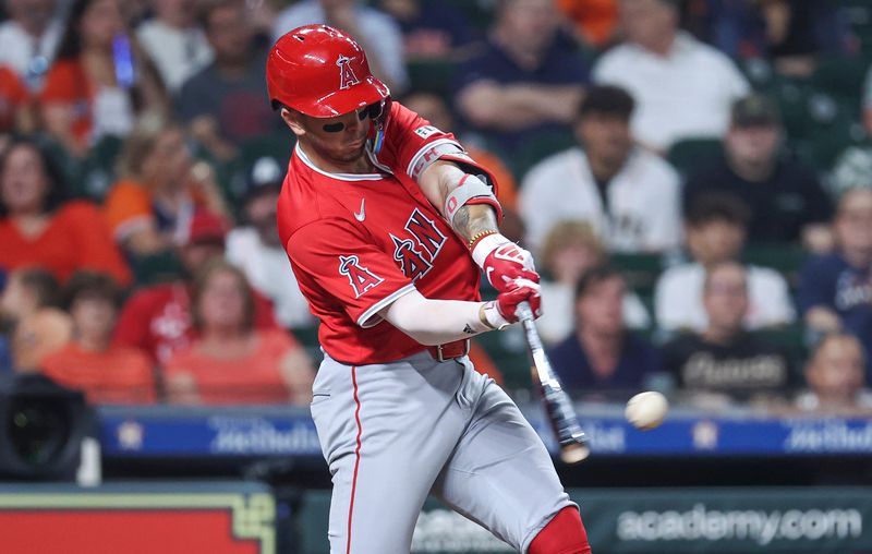 May 21, 2024; Houston, Texas, USA; Los Angeles Angels shortstop Zach Neto (9) hits an RBI double during the fourth inning against the Houston Astros at Minute Maid Park. Mandatory Credit: Troy Taormina-USA TODAY Sports