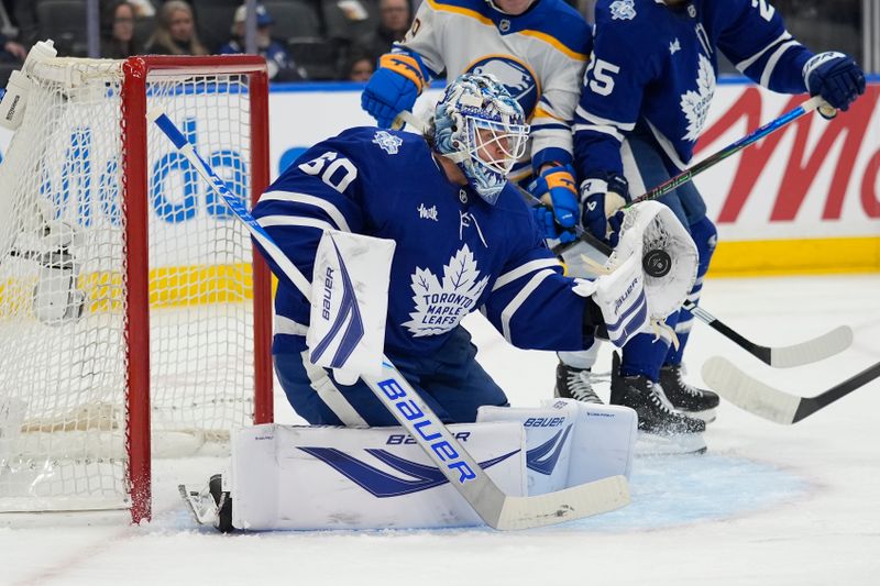 Jan 27, 2026; Toronto, Ontario, CAN; Toronto Maple Leafs goaltender Joseph Woll (60) makes a glove save against the Buffalo Sabres during the second period at Scotiabank Arena. Mandatory Credit: John E. Sokolowski-Imagn Images