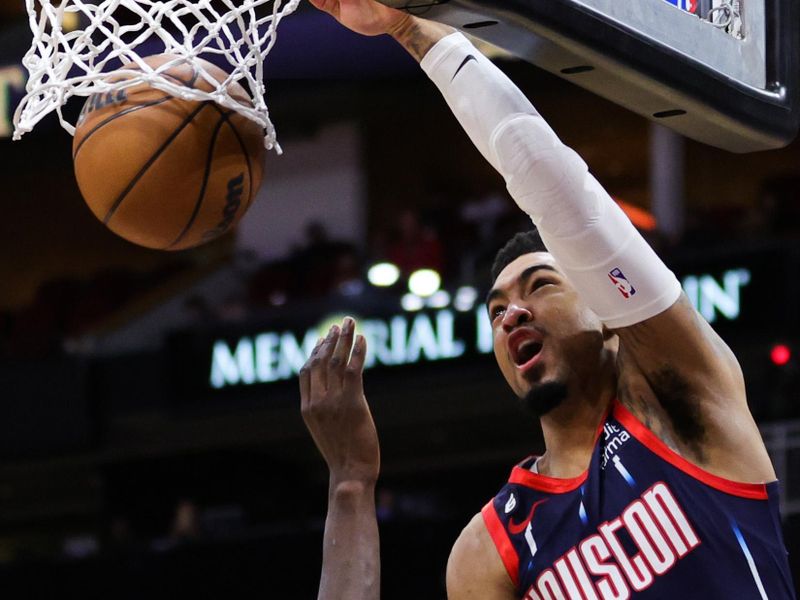 HOUSTON, TEXAS - FEBRUARY 03: Kenyon Martin Jr. #6 of the Houston Rockets dunks the ball ahead of Chris Boucher #25 of the Toronto Raptors during the first half at Toyota Center on February 03, 2023 in Houston, Texas. NOTE TO USER: User expressly acknowledges and agrees that, by downloading and or using this photograph, User is consenting to the terms and conditions of the Getty Images License Agreement. (Photo by Carmen Mandato/Getty Images)