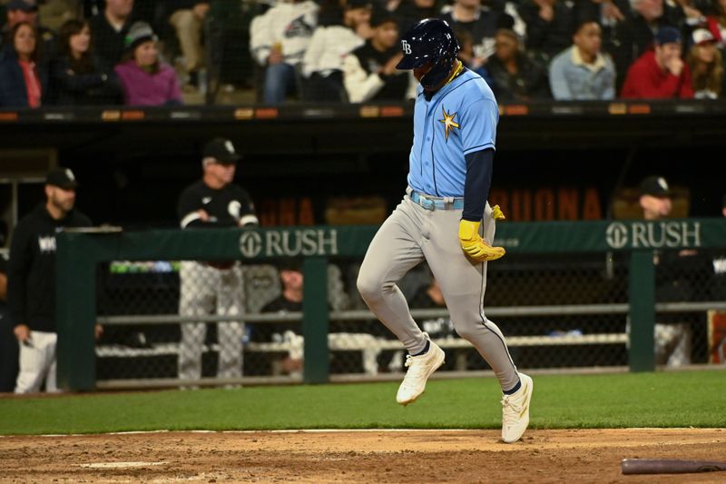 Apr 29, 2023; Chicago, Illinois, USA; Tampa Bay Rays center fielder Jose Siri (22) scores against the Chicago White Sox seventh inning  at Guaranteed Rate Field. Mandatory Credit: Matt Marton-USA TODAY Sports