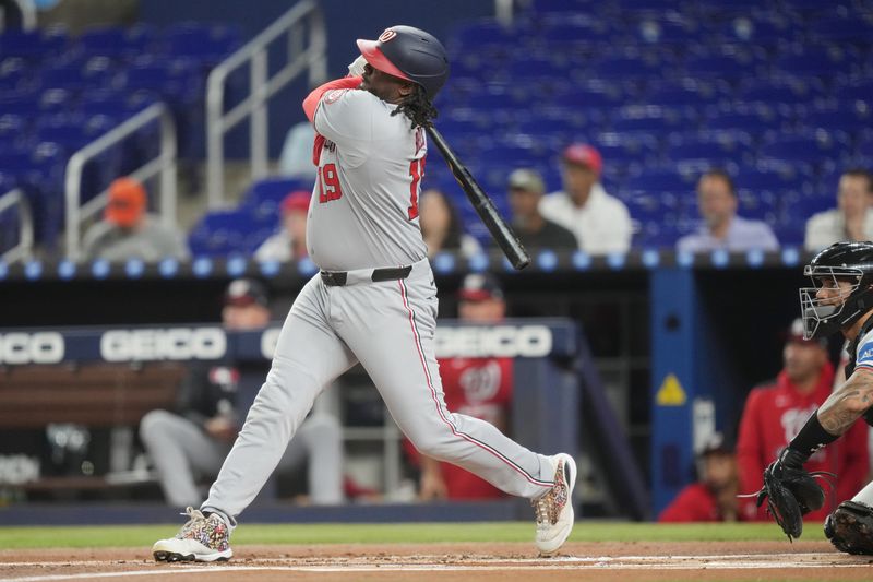 Sep 9, 2025; Miami, Florida, USA;  Washington Nationals first baseman Josh Bell (19) hits a three-run home run in the first inning against the Miami Marlins at loanDepot Park. Mandatory Credit: Jim Rassol-Imagn Images