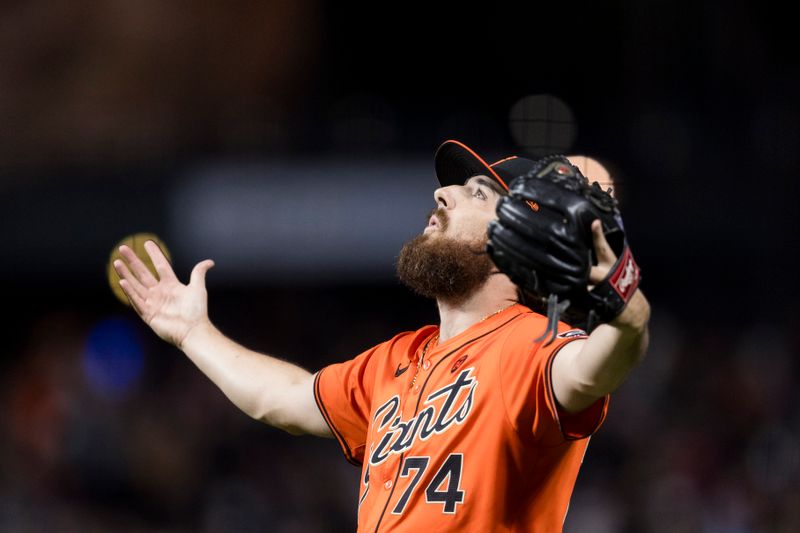 Aug 30, 2024; San Francisco, California, USA; San Francisco Giants pitcher Ryan Walker (74) celebrates the win over the Miami Marlins at Oracle Park. Mandatory Credit: John Hefti-USA TODAY Sports