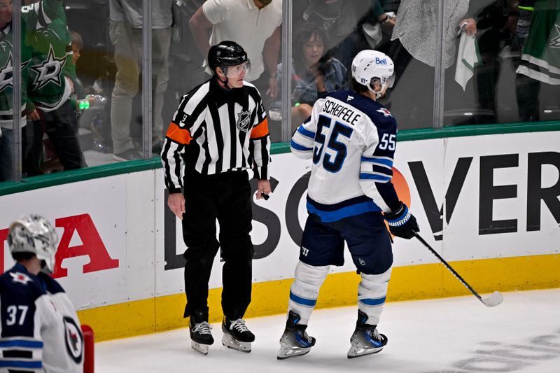 May 17, 2025; Dallas, Texas, USA; Winnipeg Jets center Mark Scheifele (55) is called for tripping on Dallas Stars center Sam Steel (not pictured) during the third period in game six of the second round of the 2025 Stanley Cup Playoffs at American Airlines Center. Mandatory Credit: Jerome Miron-Imagn Images
