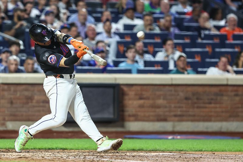 Sep 19, 2024; New York City, New York, USA;  New York Mets catcher Francisco Alvarez (4) hits a three run home run in the fourth inning against the Philadelphia Phillies at Citi Field. Mandatory Credit: Wendell Cruz-Imagn Images