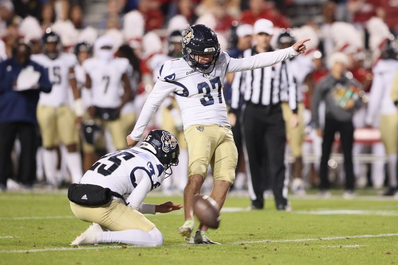 Nov 18, 2023; Fayetteville, Arkansas, USA; FIU Panthers kicker Chase Gabriel (37) misses a field goal in the second quarter against the Arkansas Razorbacks at Donald W. Reynolds Razorback Stadium. Mandatory Credit: Nelson Chenault-USA TODAY Sports