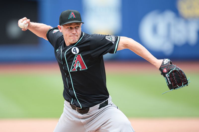 Jun 2, 2024; New York City, New York, USA; Arizona Diamondbacks relief pitcher Paul Sewald (38) delivers a pitch during the ninth inning against the New York Mets at Citi Field. Mandatory Credit: Vincent Carchietta-USA TODAY Sports