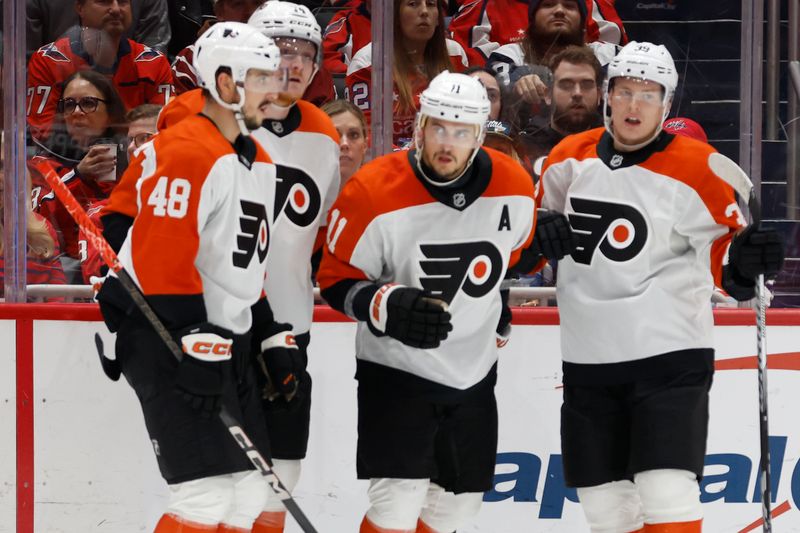 Oct 23, 2024; Washington, District of Columbia, USA; Philadelphia Flyers right wing Travis Konecny (11) celebrates with teammates after scoring a goal against the Washington Capitals in the second period at Capital One Arena. Mandatory Credit: Geoff Burke-Imagn Images