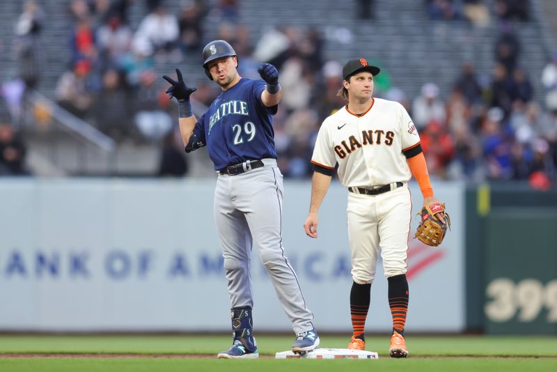 Jul 5, 2023; San Francisco, California, USA; Seattle Mariners catcher Cal Raleigh (29) reacts after hitting a double during the fifth inning against the San Francisco Giants at Oracle Park. Mandatory Credit: Sergio Estrada-USA TODAY Sports