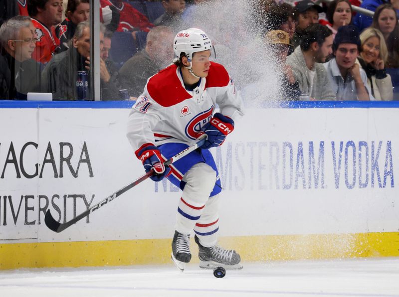 Dec 9, 2023; Buffalo, New York, USA;  Montreal Canadiens center Jake Evans (71) looks to play the puck during the second period against the Buffalo Sabres at KeyBank Center. Mandatory Credit: Timothy T. Ludwig-USA TODAY Sports