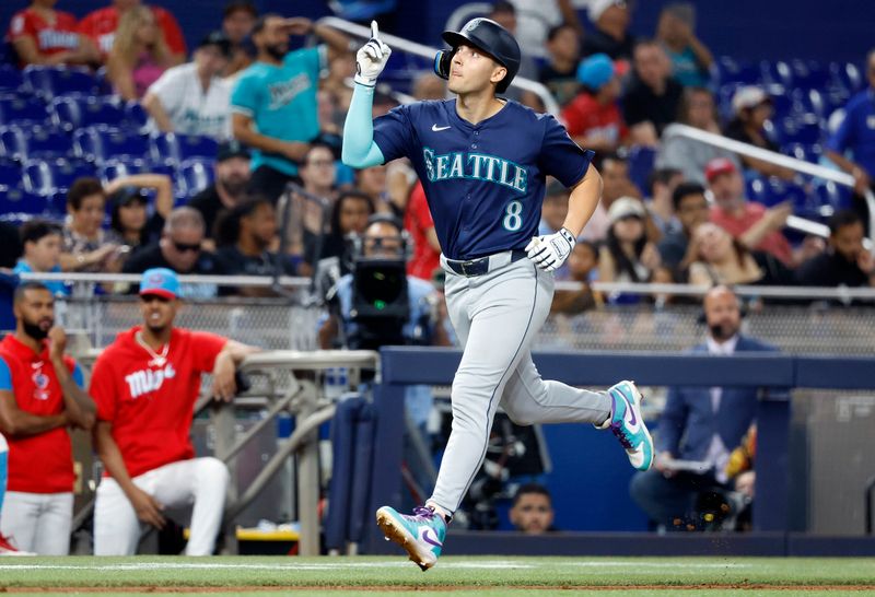 Jun 22, 2024; Miami, Florida, USA;  Seattle Mariners right fielder Dominic Canzone (8) celebrates after hitting a solo home run against the Miami Marlins in the fifth inning at loanDepot Park. Mandatory Credit: Rhona Wise-USA TODAY Sports
