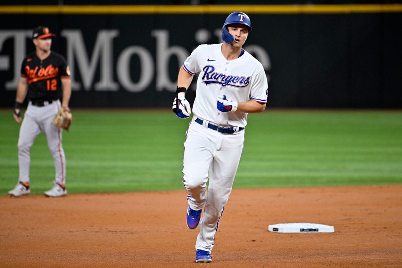 Oct 10, 2023; Arlington, Texas, USA; Texas Rangers shortstop Corey Seager (5) runs after hitting a solo home run against the Baltimore Orioles in the first inning during game three of the ALDS for the 2023 MLB playoffs at Globe Life Field. Mandatory Credit: Jerome Miron-USA TODAY Sports