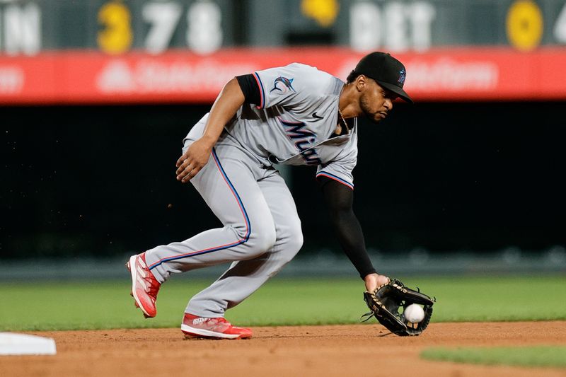 Aug 27, 2024; Denver, Colorado, USA; Miami Marlins second baseman Otto Lopez (61) fields the ball in the fifth inning against the Colorado Rockies at Coors Field. Mandatory Credit: Isaiah J. Downing-USA TODAY Sports