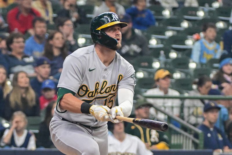 Jun 11, 2023; Milwaukee, Wisconsin, USA; Oakland Athletes left fielder Seth Brown (15) hits a 3-run home run against the Milwaukee Brewers in the fourth inning at American Family Field. Mandatory Credit: Benny Sieu-USA TODAY Sports