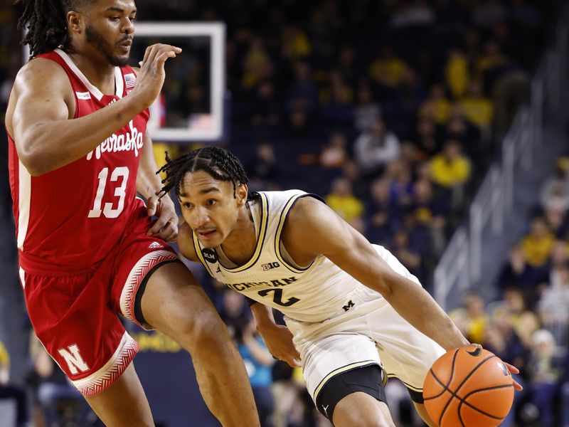 Feb 8, 2023; Ann Arbor, Michigan, USA;  Michigan Wolverines guard Kobe Bufkin (2) dribbles on Nebraska Cornhuskers forward Derrick Walker (13) in the first half at Crisler Center. Mandatory Credit: Rick Osentoski-USA TODAY Sports