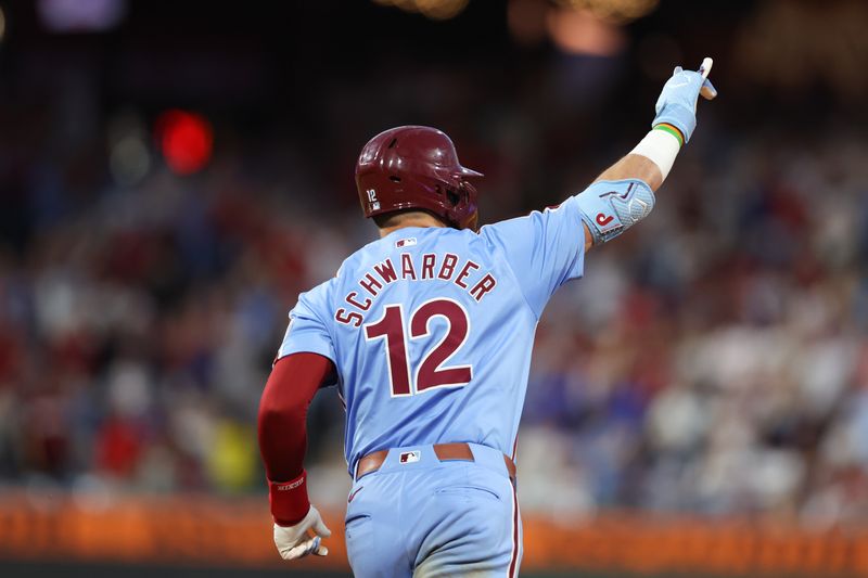 Jul 11, 2024; Philadelphia, Pennsylvania, USA; Philadelphia Phillies designated hitter Kyle Schwarber (12) runs the bases after hitting a home run during the eighth inning against the Los Angeles Dodgers at Citizens Bank Park. Mandatory Credit: Bill Streicher-USA TODAY Sports