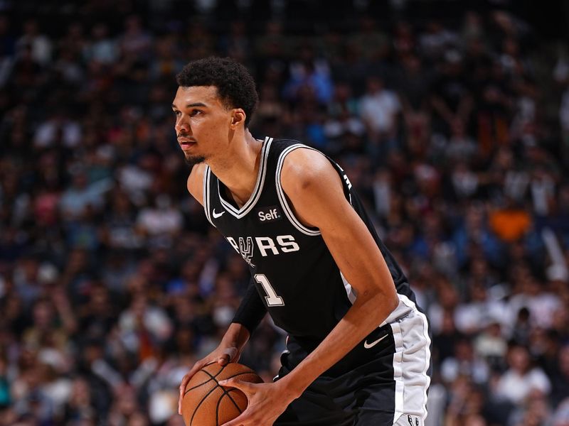 SAN ANTONIO, TX - APRIL 12: Victor Wembanyama #1 of the San Antonio Spurs looks to pass the ball during the game against the Denver Nuggets on April 12, 2024 at the Frost Bank Center in San Antonio, Texas. NOTE TO USER: User expressly acknowledges and agrees that, by downloading and or using this photograph, user is consenting to the terms and conditions of the Getty Images License Agreement. Mandatory Copyright Notice: Copyright 2024 NBAE (Photos by Garrett Ellwood/NBAE via Getty Images)