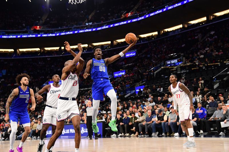 INGLEWOOD, CA - OCTOBER 14: Jazian Gortman #00 of the Dallas Mavericks drives to the basket during the game against the LA Clippers during a NBA Preseason game on October 14, 2024 at the Intuit Dome in Inglewood, California. NOTE TO USER: User expressly acknowledges and agrees that, by downloading and/or using this Photograph, user is consenting to the terms and conditions of the Getty Images License Agreement. Mandatory Copyright Notice: Copyright 2024 NBAE (Photo by Adam Pantozzi/NBAE via Getty Images)