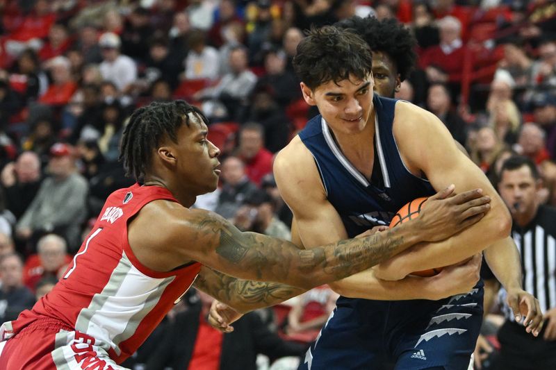 Jan 28, 2023; Las Vegas, Nevada, USA; UNLV Runnin' Rebels guard Elijah Parquet (1) and Nevada Wolf Pack guard Daniel Foster (20) battle in the second half at Thomas & Mack Center. Mandatory Credit: Candice Ward-USA TODAY Sports