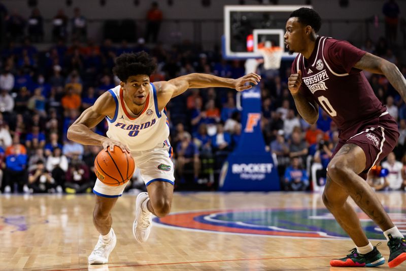 Jan 24, 2024; Gainesville, Florida, USA; Florida Gators guard Zyon Pullin (0) drives to the basket against Mississippi State Bulldogs forward D.J. Jeffries (0) during the second half at Exactech Arena at the Stephen C. O'Connell Center. Mandatory Credit: Matt Pendleton-USA TODAY Sports