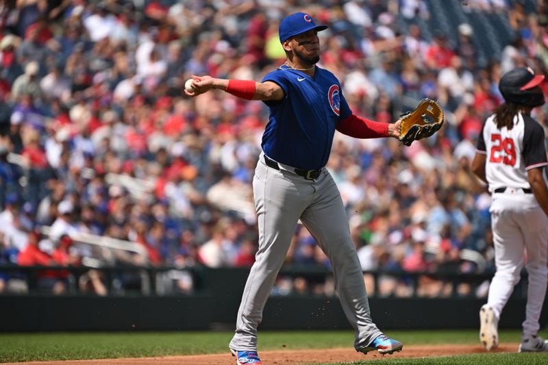 Sep 1, 2024; Washington, District of Columbia, USA; Chicago Cubs third baseman Isaac Paredes (17) attempts a throw to first base against the Washington Nationals during the second inning at Nationals Park. Mandatory Credit: Rafael Suanes-USA TODAY Sports