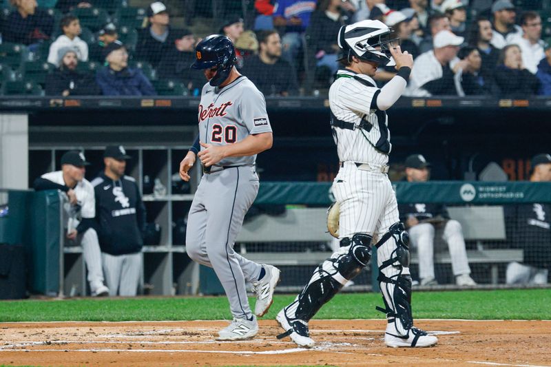 Jun 4, 2025; Chicago, Illinois, USA; Detroit Tigers first baseman Spencer Torkelson (20) scores against the Chicago White Sox during the first inning at Rate Field. Mandatory Credit: Kamil Krzaczynski-Imagn Images