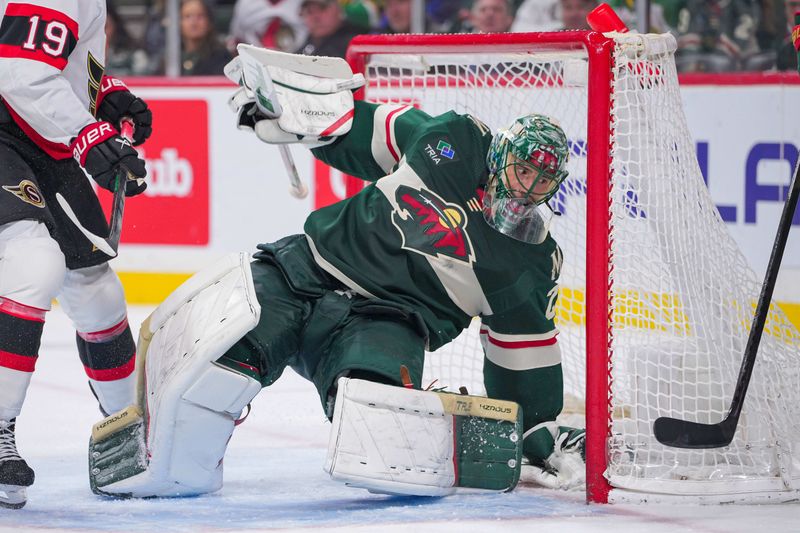 Apr 2, 2024; Saint Paul, Minnesota, USA; Minnesota Wild goaltender Marc-Andre Fleury (29) falls into the net against the Ottawa Senators in the third period at Xcel Energy Center. Mandatory Credit: Brad Rempel-USA TODAY Sports