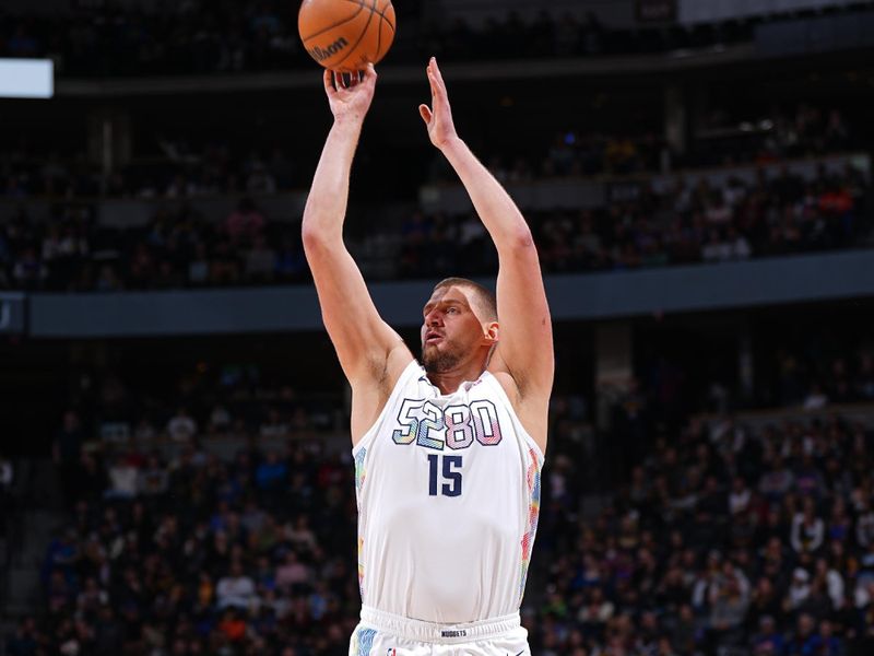 DENVER, CO - NOVEMBER 25: Nikola Jokic #15 of the Denver Nuggets shoots a three point basket during the game against the New York Knicks on November 25, 2024 at Ball Arena in Denver, Colorado. NOTE TO USER: User expressly acknowledges and agrees that, by downloading and/or using this Photograph, user is consenting to the terms and conditions of the Getty Images License Agreement. Mandatory Copyright Notice: Copyright 2024 NBAE (Photo by Garrett Ellwood/NBAE via Getty Images)