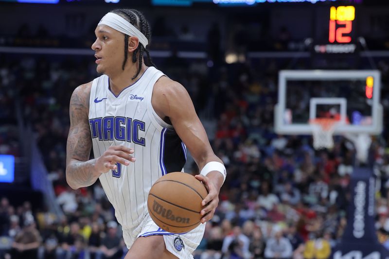 NEW ORLEANS, LOUISIANA - APRIL 03: Paolo Banchero #5 of the Orlando Magic drives with the ball against the New Orleans Pelicans during a game at the Smoothie King Center on April 03, 2024 in New Orleans, Louisiana. NOTE TO USER: User expressly acknowledges and agrees that, by downloading and or using this Photograph, user is consenting to the terms and conditions of the Getty Images License Agreement. (Photo by Jonathan Bachman/Getty Images)