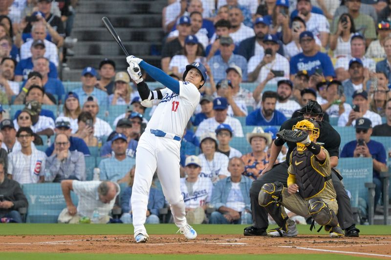 Oct 5, 2024; Los Angeles, California, USA; Los Angeles Dodgers designated hitter Shohei Ohtani (17) flies out in the first inning against the San Diego Padres during game one of the NLDS for the 2024 MLB Playoffs at Dodger Stadium. Mandatory Credit: Jayne Kamin-Oncea-Imagn Images