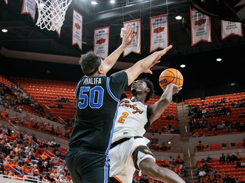 Feb 17, 2024; Stillwater, Oklahoma, USA; Oklahoma State Cowboys forward Eric Dailey Jr. (2) shoots the ball over Brigham Young Cougars center Aly Khalifa (50) during the first half at Gallagher-Iba Arena. Mandatory Credit: William Purnell-USA TODAY Sports