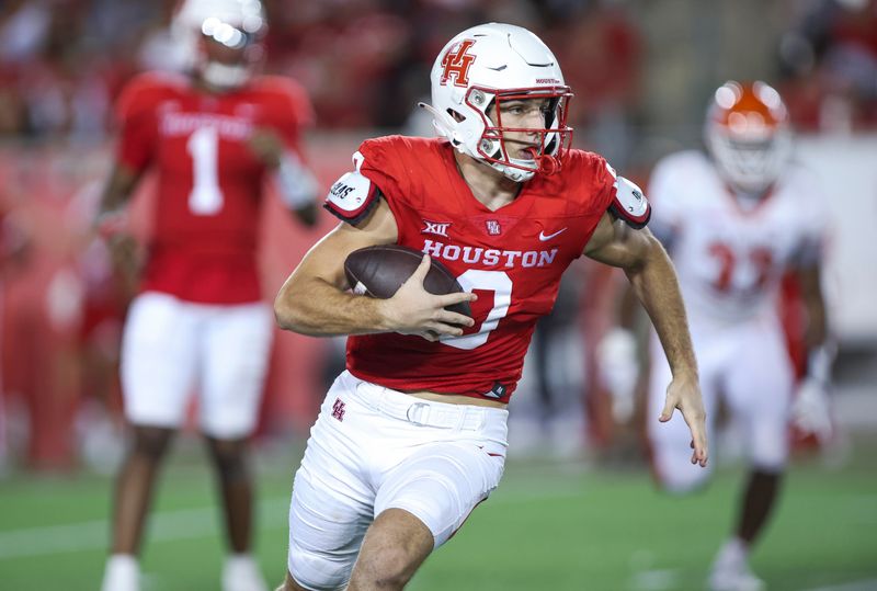 Sep 23, 2023; Houston, Texas, USA; Houston Cougars wide receiver Joseph Manjack IV (0) runs with the ball after a reception during the third quarter against the Sam Houston State Bearkats at TDECU Stadium. Mandatory Credit: Troy Taormina-USA TODAY Sports