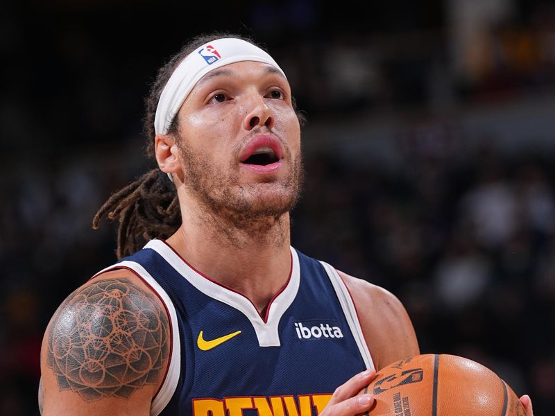 DENVER, CO - DECEMBER 13:  Aaron Gordon #32 of the Denver Nuggets shoots a free throw during the game against the LA Clipperson December 13, 2024 at Ball Arena in Denver, Colorado. NOTE TO USER: User expressly acknowledges and agrees that, by downloading and/or using this Photograph, user is consenting to the terms and conditions of the Getty Images License Agreement. Mandatory Copyright Notice: Copyright 2024 NBAE (Photo by Bart Young/NBAE via Getty Images)