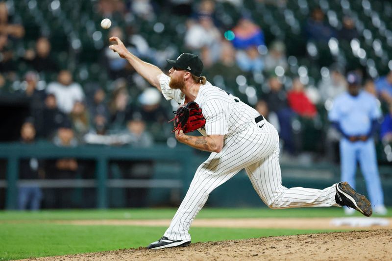 May 27, 2024; Chicago, Illinois, USA; Chicago White Sox relief pitcher Michael Kopech (34) delivers a pitch against the Toronto Blue Jays during the ninth inning at Guaranteed Rate Field. Mandatory Credit: Kamil Krzaczynski-USA TODAY Sports