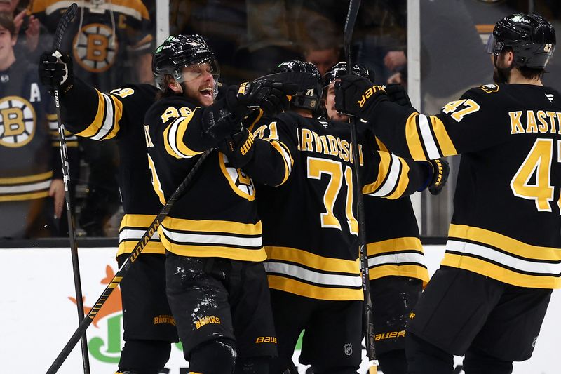 Jan 27, 2026; Boston, Massachusetts, USA; Boston Bruins right wing David Pastrnak (88) is mobbed by teammates after scoring the winning goal in overtime against the Nashville Predators at TD Garden. Mandatory Credit: Winslow Townson-Imagn Images