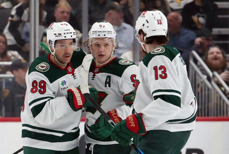 Oct 29, 2024; Pittsburgh, Pennsylvania, USA;  Minnesota Wild center Frederick Gaudreau (89) and center Yakov Trenin (13) congratulate left wing Kirill Kaprizov (97) on his goal against the Pittsburgh Penguins during the third period at PPG Paints Arena. Mandatory Credit: Charles LeClaire-Imagn Images