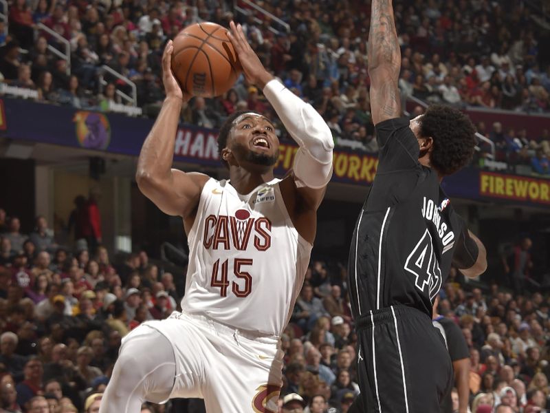 CLEVELAND, OH - NOVEMBER 9: Donovan Mitchell #45 of the Cleveland Cavaliers drives to the basket during the game against the Brooklyn Nets on November 9, 2024 at Rocket Mortgage FieldHouse in Cleveland, Ohio. NOTE TO USER: User expressly acknowledges and agrees that, by downloading and/or using this Photograph, user is consenting to the terms and conditions of the Getty Images License Agreement. Mandatory Copyright Notice: Copyright 2024 NBAE (Photo by David Liam Kyle/NBAE via Getty Images)