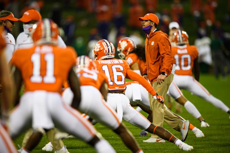 Oct 10, 2020; Clemson, South Carolina, USA; Clemson Tigers players run through warmups before a game against the Miami Hurricanes at Memorial Stadium. Mandatory Credit: Ken Ruinard-USA TODAY Sports