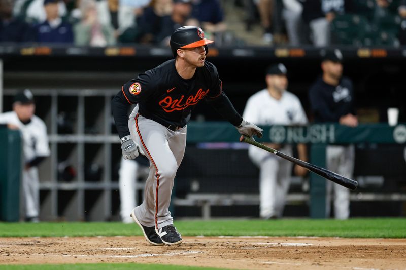 May 24, 2024; Chicago, Illinois, USA; Baltimore Orioles third baseman Jordan Westburg (11) watches his RBI-double against the Chicago White Sox during the third inning at Guaranteed Rate Field. Mandatory Credit: Kamil Krzaczynski-USA TODAY Sports