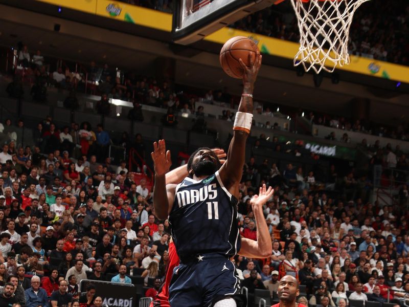 MIAMI, FL - NOVEMBER 24: Kyrie Irving #11 of the Dallas Mavericks shoots the ball during the game against the Miami Heat on November 24, 2024 at Kaseya Center in Miami, Florida. NOTE TO USER: User expressly acknowledges and agrees that, by downloading and or using this Photograph, user is consenting to the terms and conditions of the Getty Images License Agreement. Mandatory Copyright Notice: Copyright 2024 NBAE (Photo by Issac Baldizon/NBAE via Getty Images)