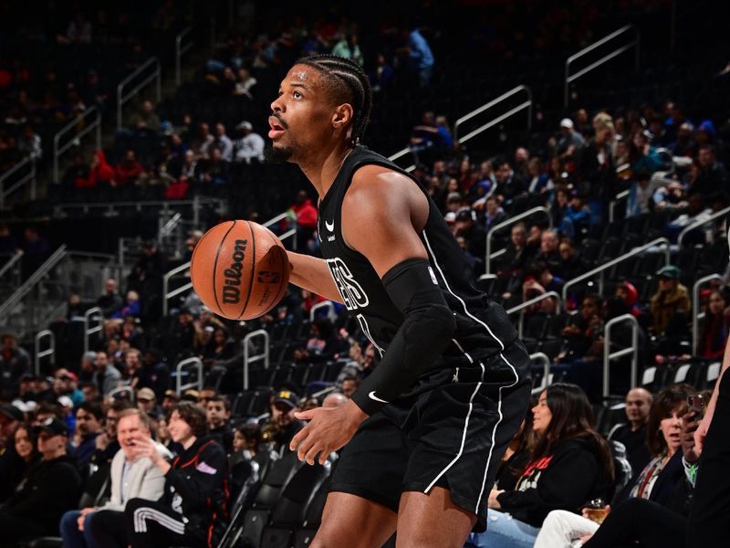 DETROIT, MI - MARCH 7: Dennis Smith Jr. #4 of the Brooklyn Nets handles the ball during the game against the Detroit Pistons on March 7, 2024 at Little Caesars Arena in Detroit, Michigan. NOTE TO USER: User expressly acknowledges and agrees that, by downloading and/or using this photograph, User is consenting to the terms and conditions of the Getty Images License Agreement. Mandatory Copyright Notice: Copyright 2024 NBAE (Photo by Chris Schwegler/NBAE via Getty Images)