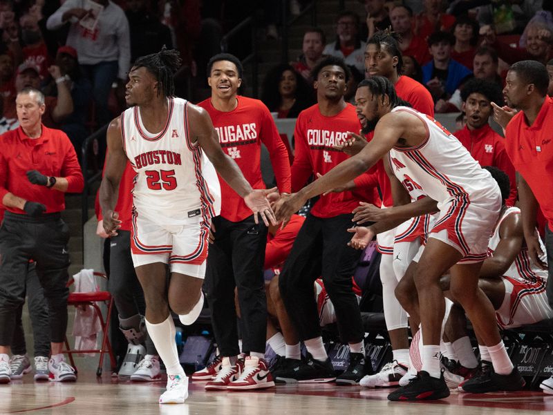 Jan 28, 2023; Houston, Texas, USA;Houston Cougars guard Terrance Arceneaux (23) celebrates Houston Cougars forward Jarace Walker (25) three point basket against the Cincinnati Bearcats in the second half at Fertitta Center. Houston Cougars won 75 to 69 .Mandatory Credit: Thomas Shea-USA TODAY Sports