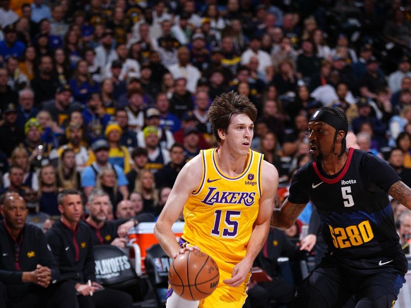 DENVER, CO - APRRIL 22: Austin Reaves #15 of the Los Angeles Lakers drives to the basket during the game against the Denver Nuggets during Round 1 Game 2 of the 2024 NBA Playoffs on April 22, 2024 at the Ball Arena in Denver, Colorado. NOTE TO USER: User expressly acknowledges and agrees that, by downloading and/or using this Photograph, user is consenting to the terms and conditions of the Getty Images License Agreement. Mandatory Copyright Notice: Copyright 2024 NBAE (Photo by Garrett Ellwood/NBAE via Getty Images)