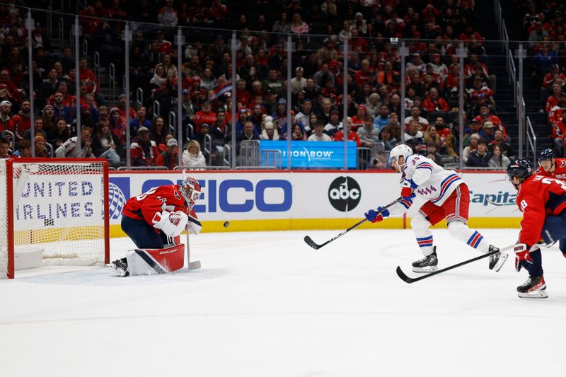 Jan 4, 2025; Washington, District of Columbia, USA;New York Rangers center Sam Carrick (39) scores a goal on Washington Capitals goaltender Logan Thompson (48) in the second period at Capital One Arena. Mandatory Credit: Geoff Burke-Imagn Images