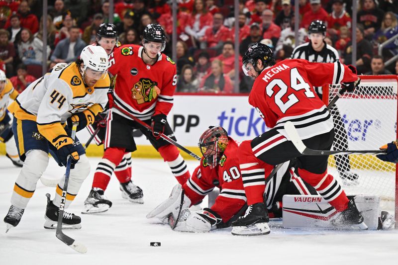 Apr 12, 2024; Chicago, Illinois, USA; Nashville Predators forward Kiefer Sherwood (44) moves in to take control of a rebound off Chicago Blackhawks goaltender Arvid Soderblom (40) in the first period at United Center. Mandatory Credit: Jamie Sabau-USA TODAY Sports