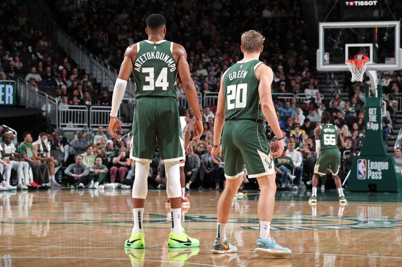 MILWAUKEE, WI - NOVEMBER 20: Giannis Antetokounmpo #34 and AJ Green #20 of the Milwaukee Bucks look on during the game against the Chicago Bulls on November 20, 2024 at the Fiserv Forum Center in Milwaukee, Wisconsin. NOTE TO USER: User expressly acknowledges and agrees that, by downloading and or using this Photograph, user is consenting to the terms and conditions of the Getty Images License Agreement. Mandatory Copyright Notice: Copyright 2024 NBAE (Photo by Gary Dineen/NBAE via Getty Images).