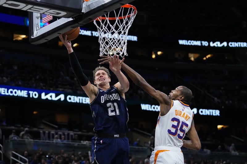 ORLANDO, FLORIDA - JANUARY 28: Moritz Wagner #21 of the Orlando Magic goes up for a shot against Kevin Durant #35 of the Phoenix Suns during the fourth quarter at Kia Center on January 28, 2024 in Orlando, Florida. NOTE TO USER: User expressly acknowledges and agrees that, by downloading and or using this photograph, User is consenting to the terms and conditions of the Getty Images License Agreement. (Photo by Rich Storry/Getty Images)