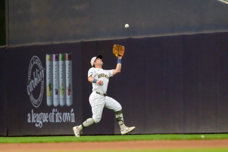 May 16, 2025; Milwaukee, Wisconsin, USA;  Milwaukee Brewers right fielder Sal Frelick (10) makes a running catch of a fly ball during the sixth inning against the Minnesota Twins at American Family Field. Mandatory Credit: Jeff Hanisch-Imagn Images
