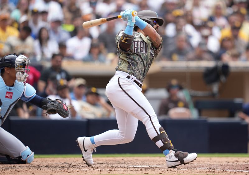 Jun 18, 2023; San Diego, California, USA;  San Diego Padres second baseman Rougned Odor (24) hits an RBI double during the fourth inning against the Tampa Bay Rays at Petco Park. Mandatory Credit: Ray Acevedo-USA TODAY Sports